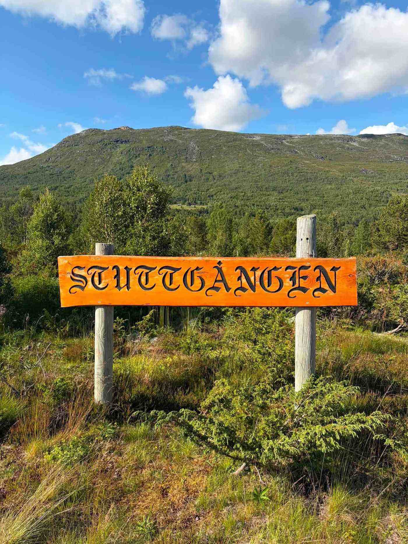 Wooden Stuttgången sign at the entrance to the campsite